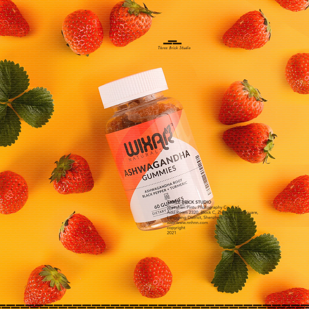 Chinese product photography vitamin bear lifestyle strawberry orange background