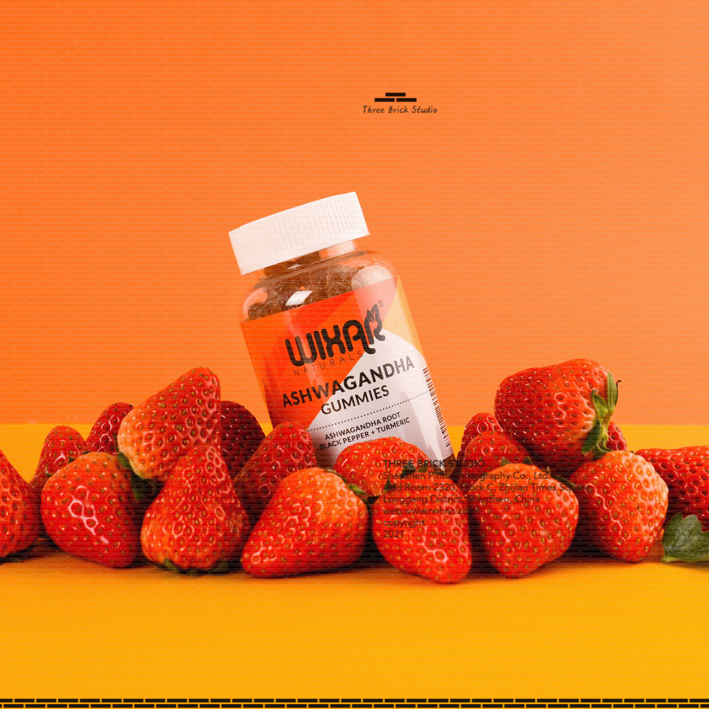 Chinese product photography vitamin bear lifestyle letter paper strawberry orange background